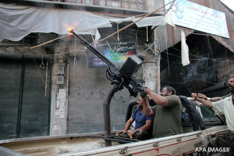 Free Syrian Army fires an anti-aircraft heavy machine gun at an army MiG-23 conducting raids on the in the old city of Aleppo on September 19. 2012. Photo by Ahmed Deeb