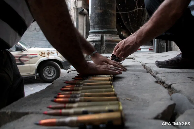 Free Syrian Army fires an anti-aircraft heavy machine gun at an army MiG-23 conducting raids on the in the old city of Aleppo on September 19. 2012. Photo by Ahmed Deeb