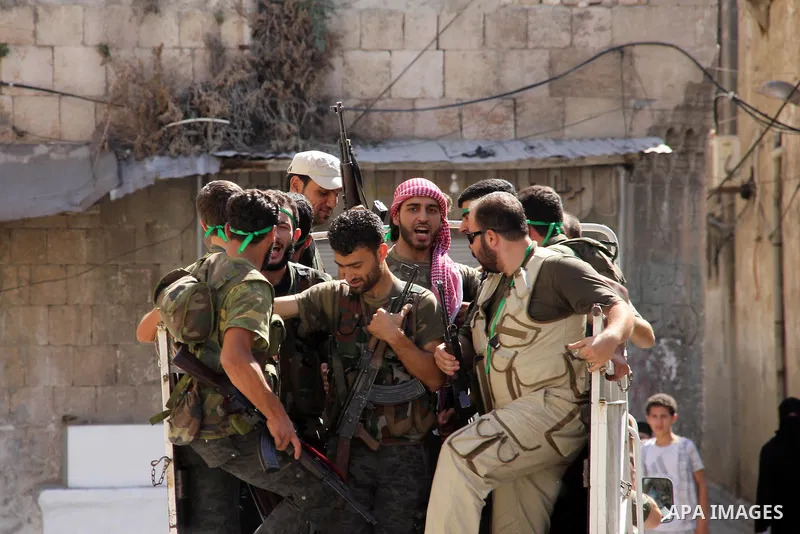 Free Syrian Army take position during clashes with regime forces near the old city market in Aleppo in northern Syria on September 20, 2012. Photo by Ahmed Deeb