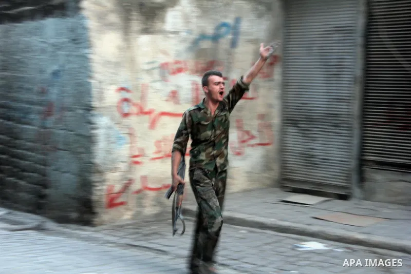 Free Syrian Army take position during clashes with regime forces in Bab al-Hadeed neighborhood in Aleppo in northern Syria on September 21, 2012. Photo by Ahmed Deeb
