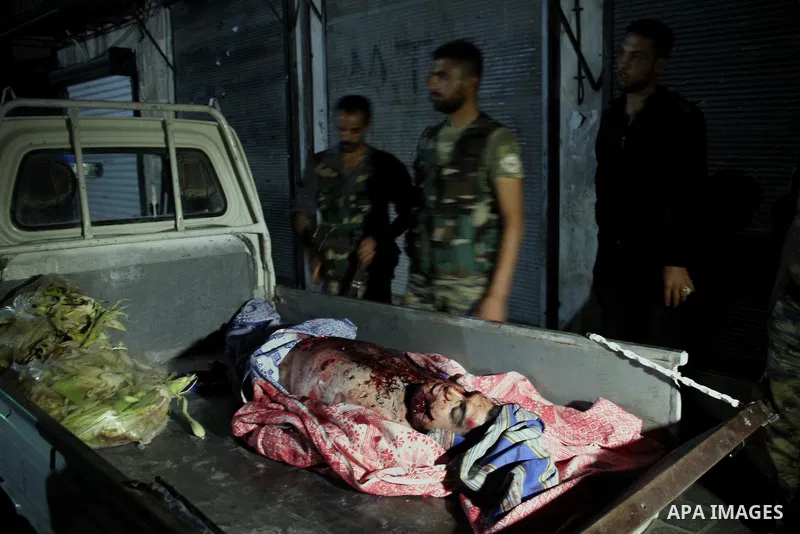 A dead Syrian man in al-Hazazeh neighborhood in the old city of Aleppo after the area was shelled by Syrian regime forces on September 22 2012. Photo by Ahmed Deeb