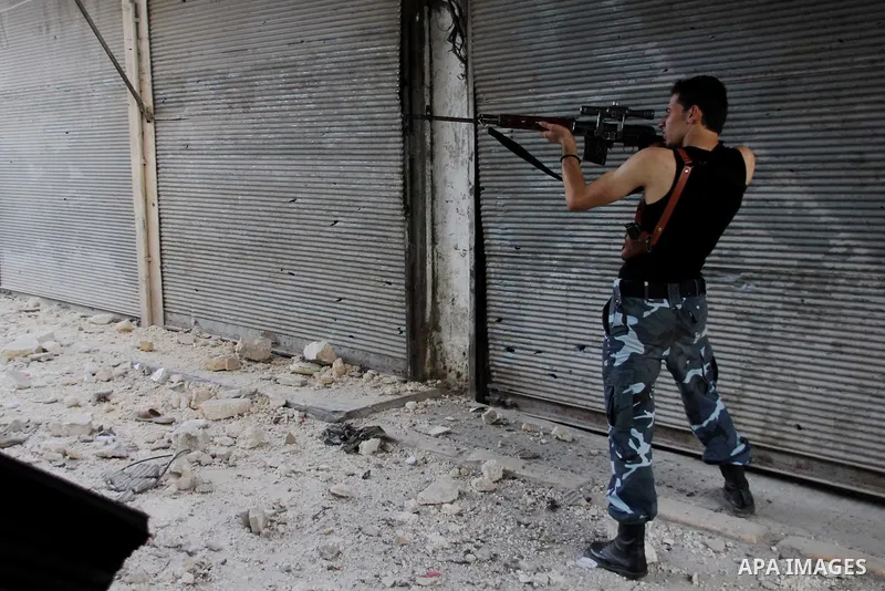 Free Syrian Army take position during clashes with regime forces in Bab al-Hadeed neighborhood in Aleppo in northern Syria on September 21, 2012. Photo by Ahmed Deeb