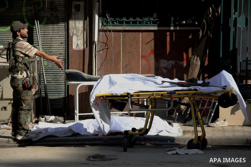A Free Syrian fighter is brought to the Dar al-Shifa hospital in the northern city of Aleppo to be treated for his wounds on September 27, 2012, as fighting in Syria's second largest city between rebel forces and governm...