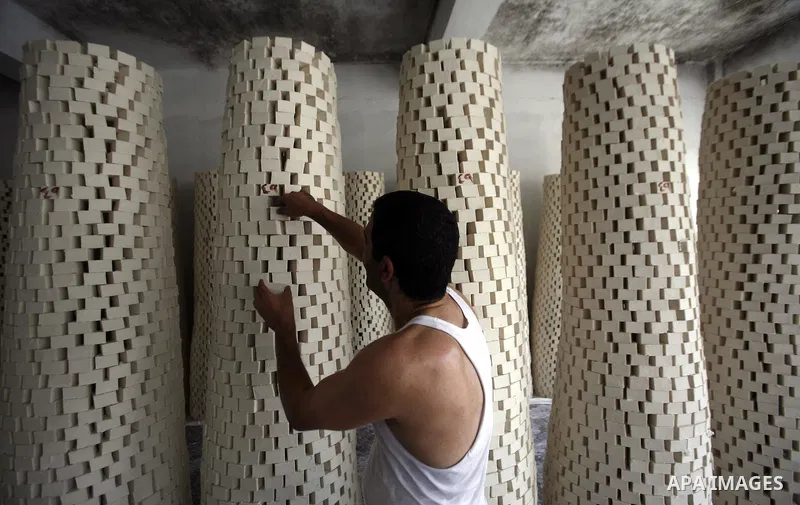 A Palestinian worker lines up soap pieces at the Touqan factory in the West Bank city of Nablus, on Oct. 11, 2012. The Touqan factory is one of the oldest manual factories in Nablus that manufactures the natural ''Nabuls...