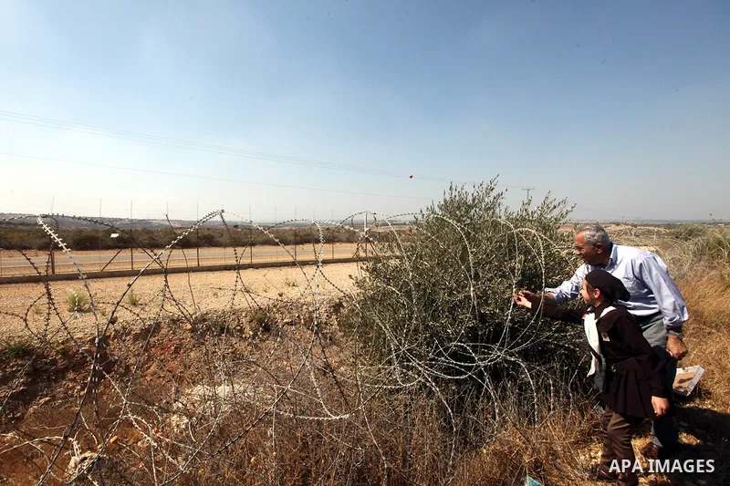 Palestinian Prime Minister Salam Fayyad attends the opening of olive harvest season in the village of Jayyous in the West Bank city of Qalqilya,11 October 2012. Photo by Mustafa Abu Dayeh