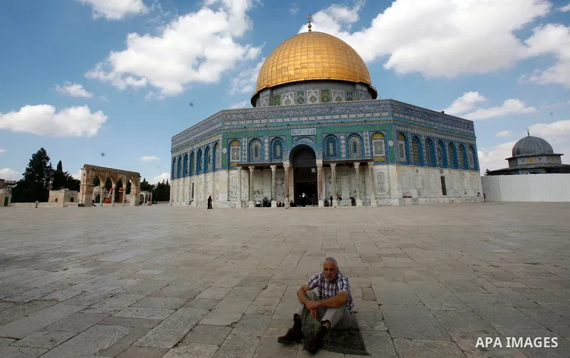 A Palestinian worshiper attends the friday prayers in front of the Dome of the Rock at al-Aqsa mosque compound, Islam's third holiest site in Jerusalem's old city on Oct. 12, 2012. Photo by Mahfouz Abu Turk
