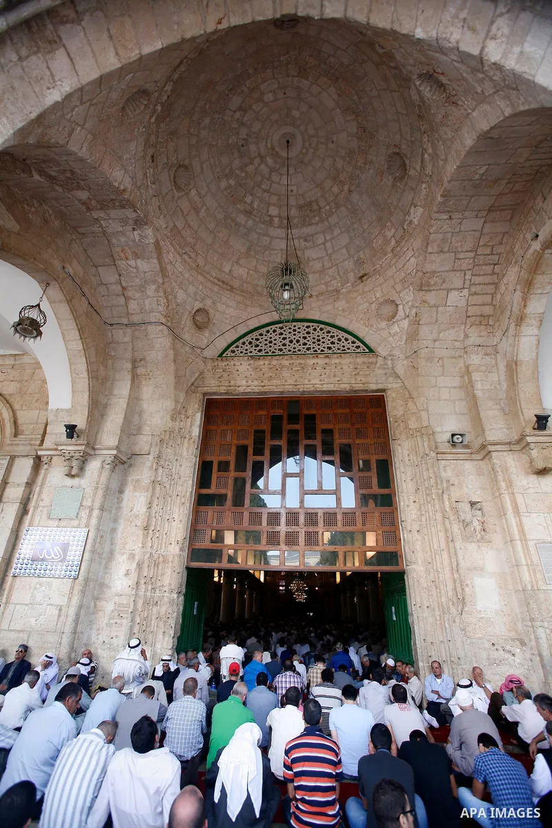 Palestinian worshipers attend the friday prayers in front of the Dome of the Rock at al-Aqsa mosque compound, Islam's third holiest site in Jerusalem's old city on Oct. 12, 2012. Photo by Mahfouz Abu Turk