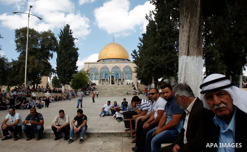 Palestinian worshipers attend the friday prayers in front of the Dome of the Rock at al-Aqsa mosque compound, Islam's third holiest site in Jerusalem's old city on Oct. 12, 2012. Photo by Mahfouz Abu Turk