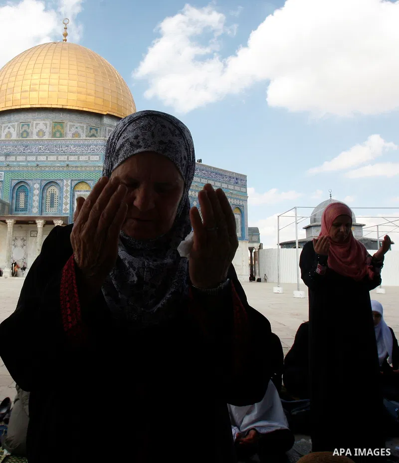 Palestinian worshipers attend the friday prayers in front of the Dome of the Rock at al-Aqsa mosque compound, Islam's third holiest site in Jerusalem's old city on Oct. 12, 2012. Photo by Mahfouz Abu Turk