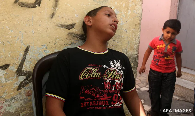 Palestinian boy cries over the death of his father, Salafist leader Hisham al-Saedini during his funeral procession at Al-Bureij refugee camp in the central Gaza Strip, on October 14, 2012. Saedini, a top Salafist leader...