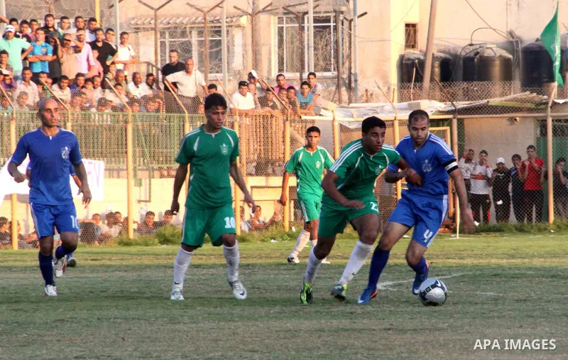 Palestinian soccer team of Rafah Youth and the team of Rafah Services, play during match in Gaza city on Oct. 14, 2012. Photo by Alaa Shamaly
