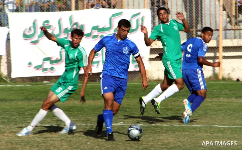 Palestinian soccer team of Rafah Youth and the team of Rafah Services, play during match in Gaza city on Oct. 14, 2012. Photo by Alaa Shamaly