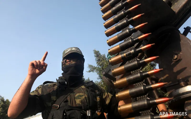 Palestinian Hamas militants take part in a march in the streets of Gaza City to mark the first anniversary of a deal which saw the exchange of 1,027 Palestinian prisoners for captured Israeli soldier Gilad Shalit, on Oct...