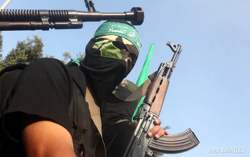 Palestinian Hamas militants take part in a march in the streets of Gaza City to mark the first anniversary of a deal which saw the exchange of 1,027 Palestinian prisoners for captured Israeli soldier Gilad Shalit, on Oct...