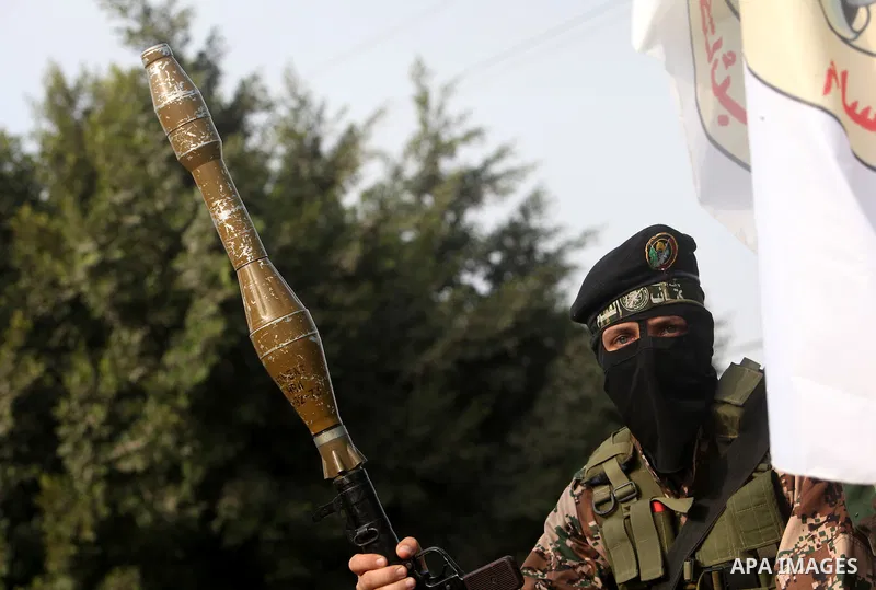 Palestinian Hamas militants take part in a march in the streets of Gaza City to mark the first anniversary of a deal which saw the exchange of 1,027 Palestinian prisoners for captured Israeli soldier Gilad Shalit, on Oct...