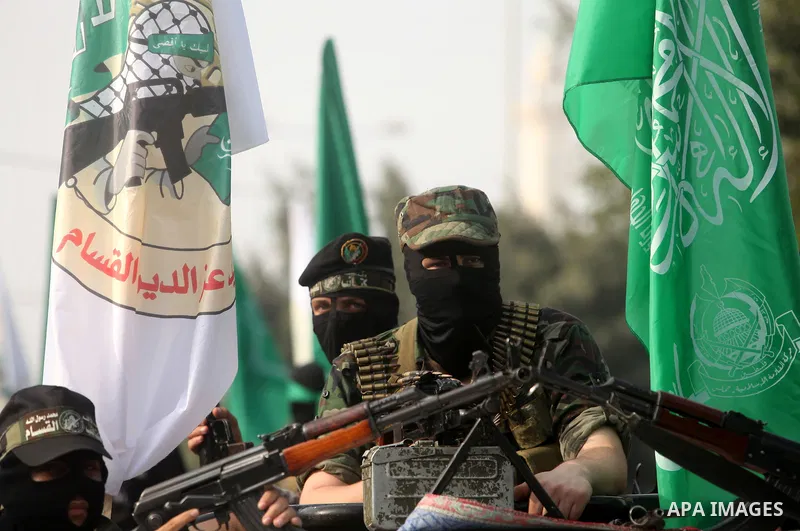 Palestinian Hamas militants take part in a march in the streets of Gaza City to mark the first anniversary of a deal which saw the exchange of 1,027 Palestinian prisoners for captured Israeli soldier Gilad Shalit, on Oct...