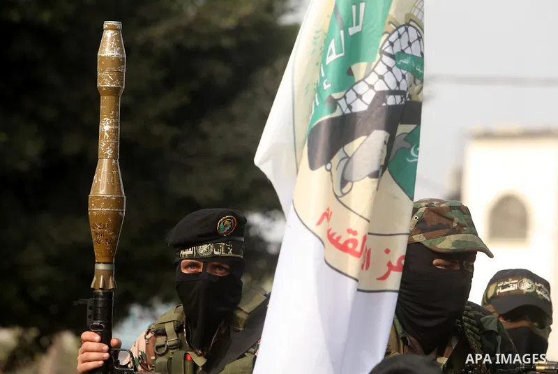 Palestinian Hamas militants take part in a march in the streets of Gaza City to mark the first anniversary of a deal which saw the exchange of 1,027 Palestinian prisoners for captured Israeli soldier Gilad Shalit, on Oct...