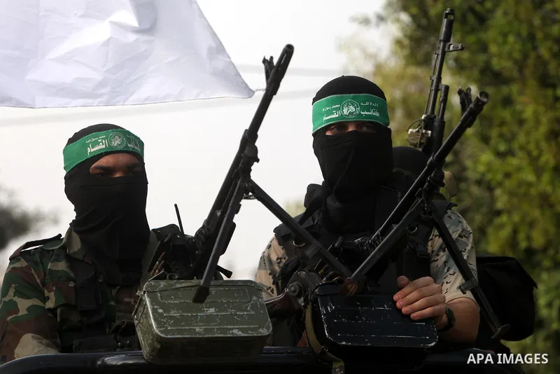 Palestinian Hamas militants take part in a march in the streets of Gaza City to mark the first anniversary of a deal which saw the exchange of 1,027 Palestinian prisoners for captured Israeli soldier Gilad Shalit, on Oct...