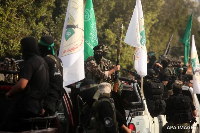 Palestinian Hamas militants take part in a march in the streets of Gaza City to mark the first anniversary of a deal which saw the exchange of 1,027 Palestinian prisoners for captured Israeli soldier Gilad Shalit, on Oct...