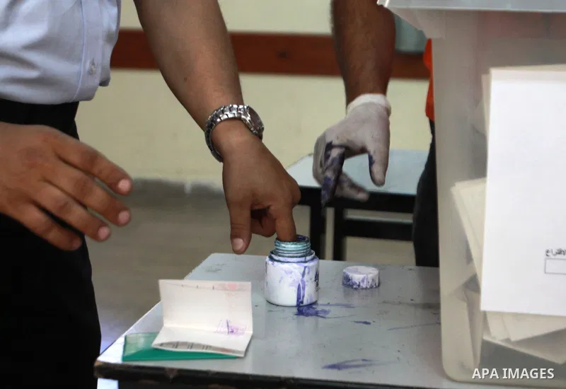 Members of the Palestinian security vote at a polling station during local elections in the West Bank city of Nablus, on October 18,2012. Members of Palestinian security forces cast an early vote ahead of local elections...