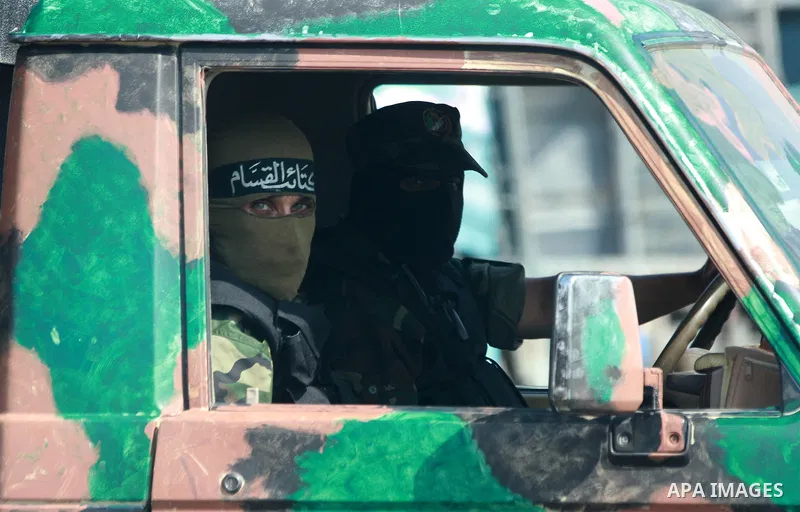 Palestinian Hamas militants take part in a rally on October 18, 2012 at the Rafah border crossing with Egypt in the southern Gaza Strip to mark the first anniversary of a deal which saw the exchange of 1,027 Palestinian...
