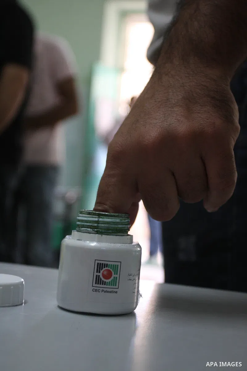 A member of Palestinian security forces casts his vote at a polling station in the West bank town of Ramallah, 18 October 2012. The polling stations will be open from seven AM to seven PM for about 13,000 members of the...
