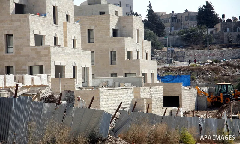 Labourers work in the jewish settlement of Harmoun Hanatsave near the Arab neighbourhood of Ras al-Amud in Jerusalem on Oct. 18,2012. Israeli government continue building Harmoun Hanatsave on the Arab villages of Jabal a...