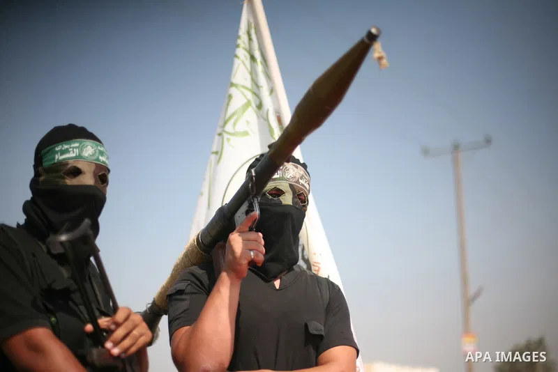 Palestinian Hamas militants take part in a rally on October 18, 2012 at the Rafah border crossing with Egypt in the southern Gaza Strip to mark the first anniversary of a deal which saw the exchange of 1,027 Palestinian...
