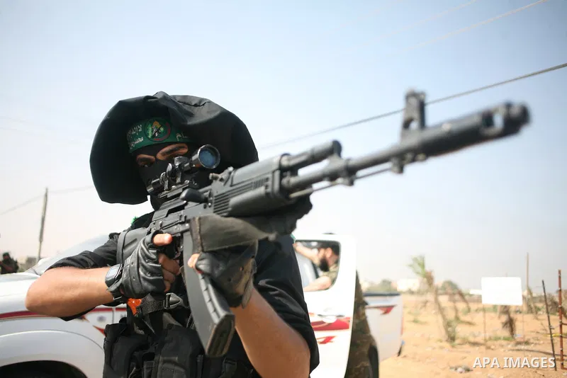 Palestinian Hamas militants take part in a rally on October 18, 2012 at the Rafah border crossing with Egypt in the southern Gaza Strip to mark the first anniversary of a deal which saw the exchange of 1,027 Palestinian...