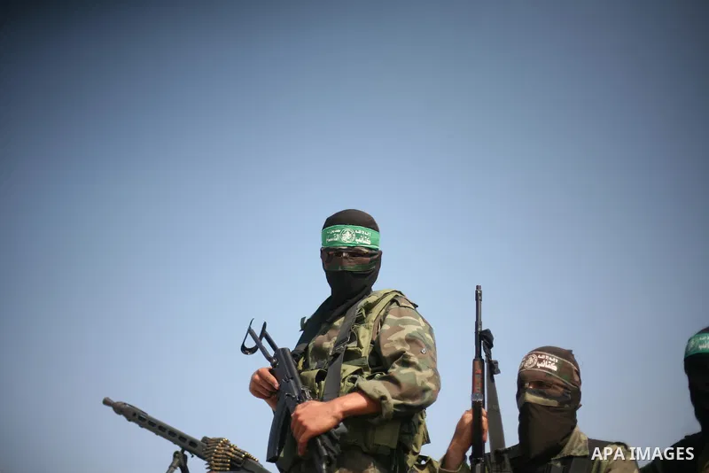 Palestinian Hamas militants take part in a rally on October 18, 2012 at the Rafah border crossing with Egypt in the southern Gaza Strip to mark the first anniversary of a deal which saw the exchange of 1,027 Palestinian...