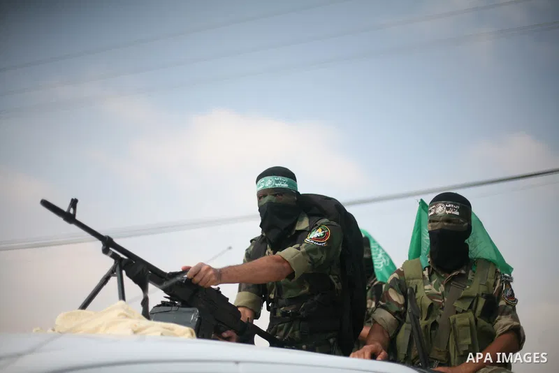 Palestinian Hamas militants take part in a rally on October 18, 2012 at the Rafah border crossing with Egypt in the southern Gaza Strip to mark the first anniversary of a deal which saw the exchange of 1,027 Palestinian...