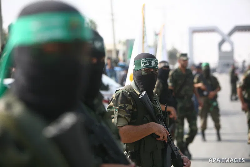 Palestinian Hamas militants take part in a rally on October 18, 2012 at the Rafah border crossing with Egypt in the southern Gaza Strip to mark the first anniversary of a deal which saw the exchange of 1,027 Palestinian...
