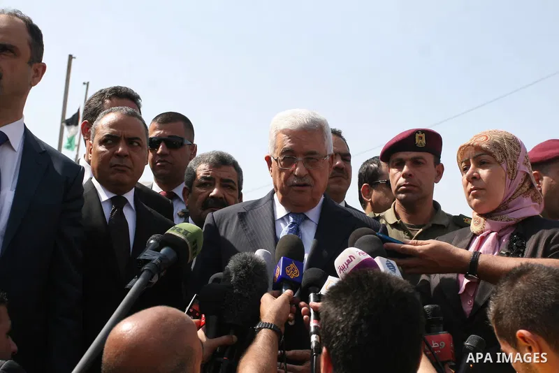 Palestinian president Mahmud Abbas speaks to the press after voting for the municipal elections at a polling station in Al-Bireh, a town adjacent to the West Bank city of Ramallah, on October 20, 2012. Palestinians in th...