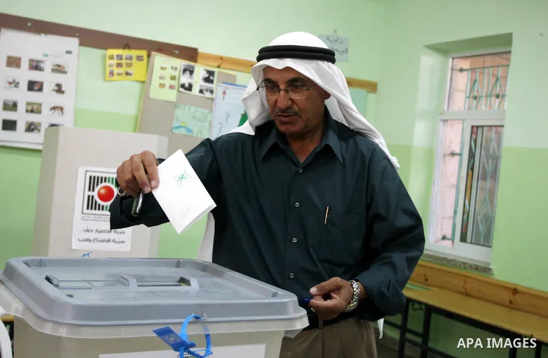 A Palestinian man casts his vote for the municipal elections at a polling station in Al-Bireh, a town adjacent to the West Bank city of Ramallah, on October 20, 2012. Palestinians in the West Bank voted in local election...