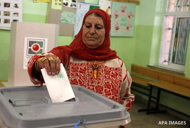 A Palestinian woman casts his vote for the municipal elections at a polling station in Al-Bireh, a town adjacent to the West Bank city of Ramallah, on October 20, 2012. Palestinians in the West Bank voted in local electi...