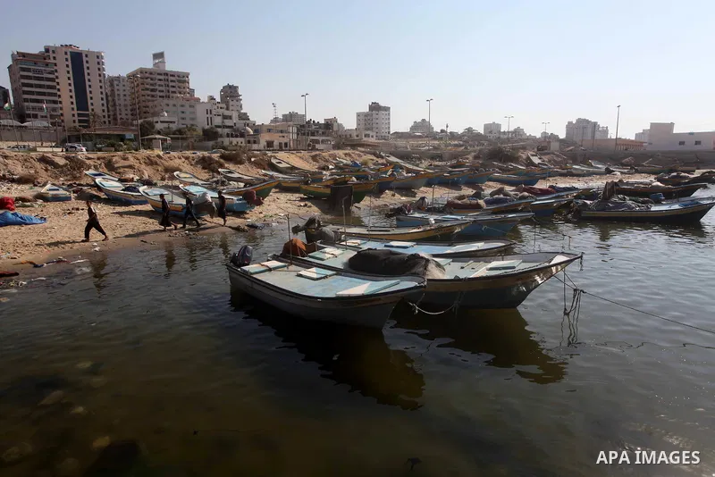 Palestinian fishermen prepare their nets in Gaza City's harbour on October 20, 2012. Israeli soldiers commandeered a vessel carrying pro-Palestinian activists destined for Gaza on Saturday, cutting off communications and...