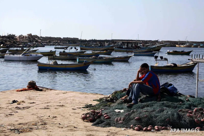 Palestinian fishermen prepare their nets in Gaza City's harbour on October 20, 2012. Israeli soldiers commandeered a vessel carrying pro-Palestinian activists destined for Gaza on Saturday, cutting off communications and...