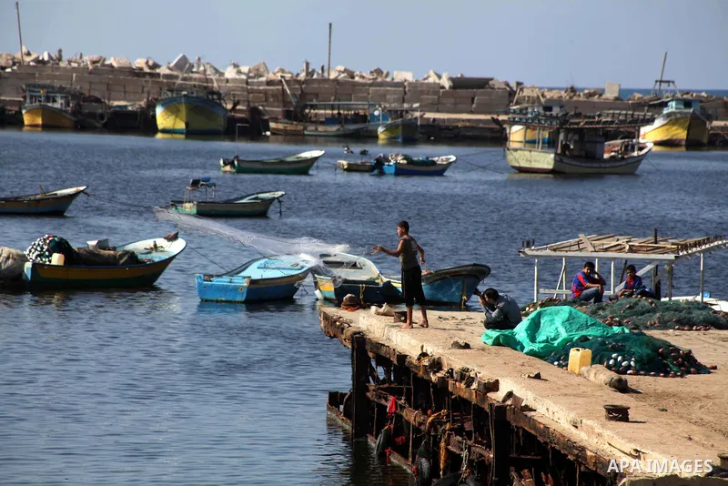 Palestinian fishermen prepare their nets in Gaza City's harbour on October 20, 2012. Israeli soldiers commandeered a vessel carrying pro-Palestinian activists destined for Gaza on Saturday, cutting off communications and...