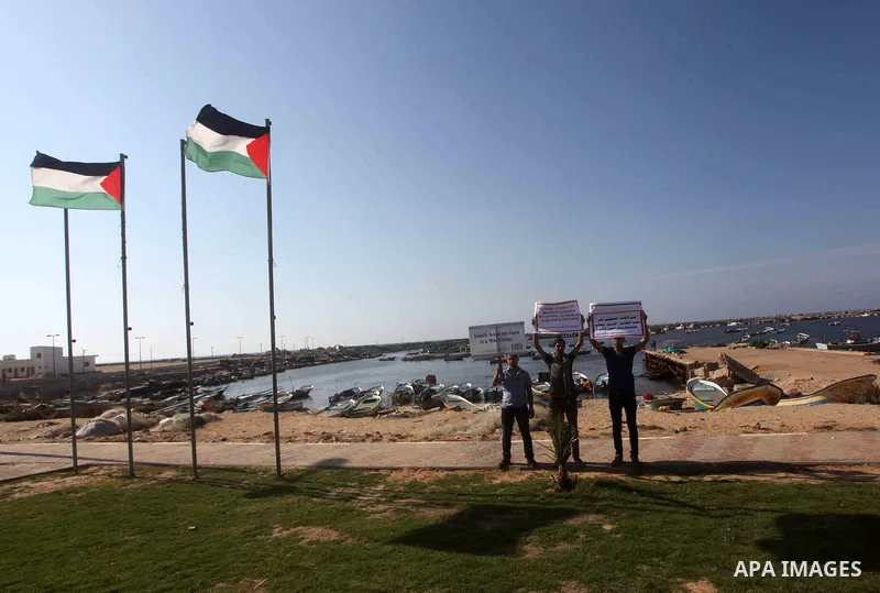 Palestinians participate a press conference to support the Gaza-bound flotilla in the port of Gaza City, Saturday, Oct. 20 , 2012. Israeli soldiers commandeered a vessel carrying pro-Palestinian activists destined for Ga...