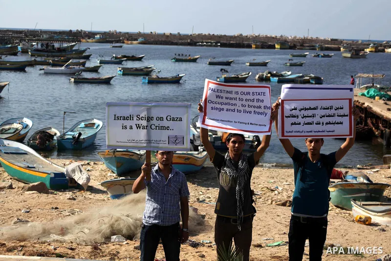 Palestinians participate a press conference to support the Gaza-bound flotilla in the port of Gaza City, Saturday, Oct. 20 , 2012. Israeli soldiers commandeered a vessel carrying pro-Palestinian activists destined for Ga...