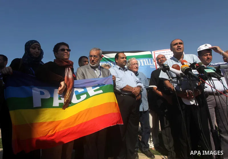 Jewish-American scholar and activist Noam Chomsky stands during a press conference to support the Gaza-bound flotilla in the port of Gaza City, Saturday, Oct. 20 , 2012. Israeli soldiers commandeered a vessel carrying pr...