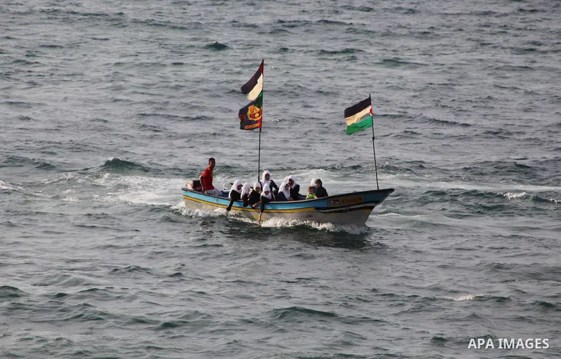 Palestinian girls ride on the deck of a boat off the coast of Gaza city during a school trip on October 21, 2012. Gaza beach is the only outlet for the Palestinians after tightening the Israeli blockade on the Gaza Strip...