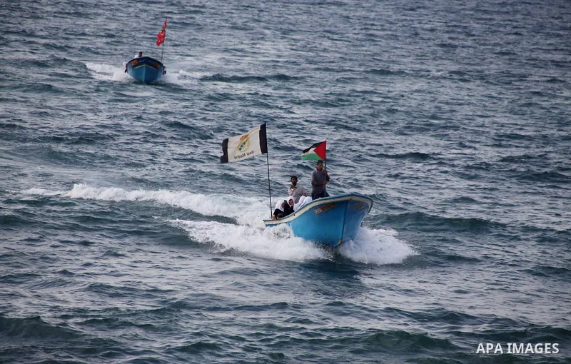 Palestinian girls ride on the deck of a boat off the coast of Gaza city during a school trip on October 21, 2012. Gaza beach is the only outlet for the Palestinians after tightening the Israeli blockade on the Gaza Strip...