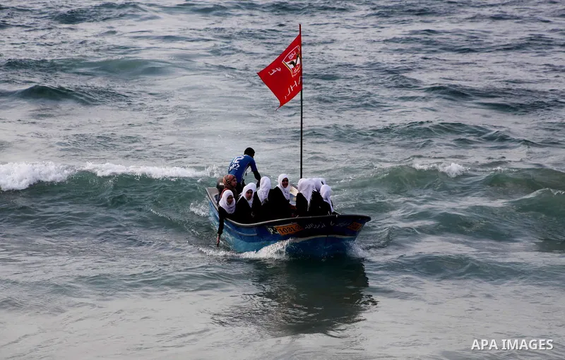 Palestinian girls ride on the deck of a boat off the coast of Gaza city during a school trip on October 21, 2012. Gaza beach is the only outlet for the Palestinians after tightening the Israeli blockade on the Gaza Strip...