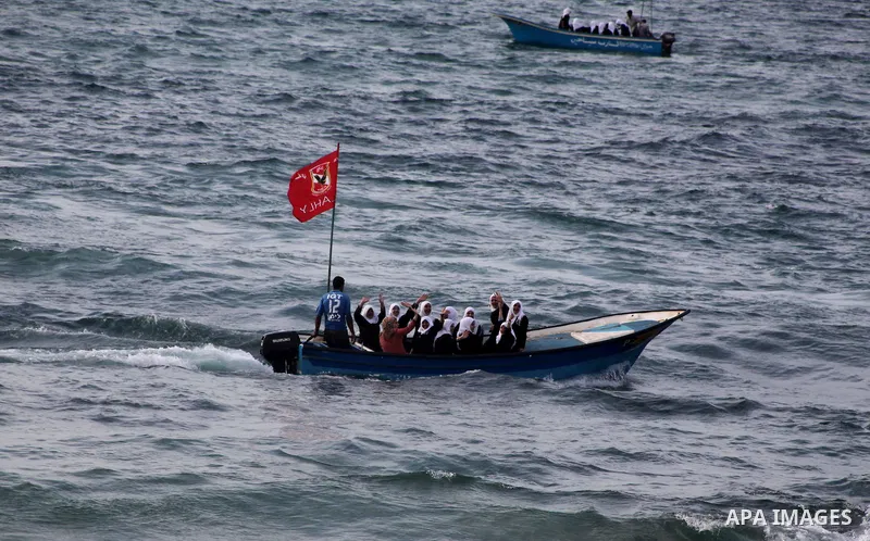 Palestinian girls ride on the deck of a boat off the coast of Gaza city during a school trip on October 21, 2012. Gaza beach is the only outlet for the Palestinians after tightening the Israeli blockade on the Gaza Strip...
