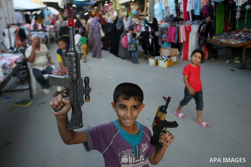 Palestinians shop in preparing to the celebration of Eid al-Adha festival at a market at the main market in Rafah southern Gaza strip, oct. 22, 2012. Muslims around the world prepare to celebrate Eid Al-Adha, which accor...