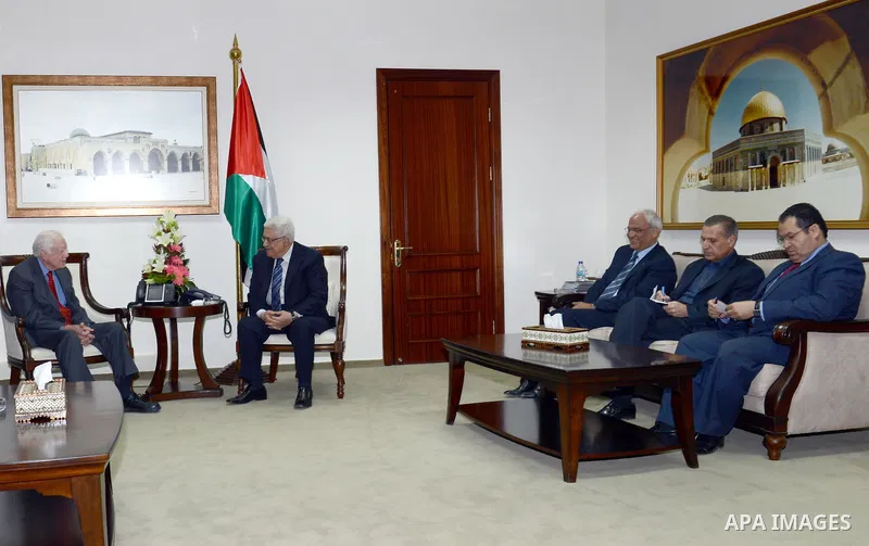 Palestinian President Mahmoud Abbas meets with the Former US President Jimmy Carter (L) in the West Bank town of Ramallah, 22 October 2012. Carter along with other member of the group of 'Elders' was meeting with the Pal...