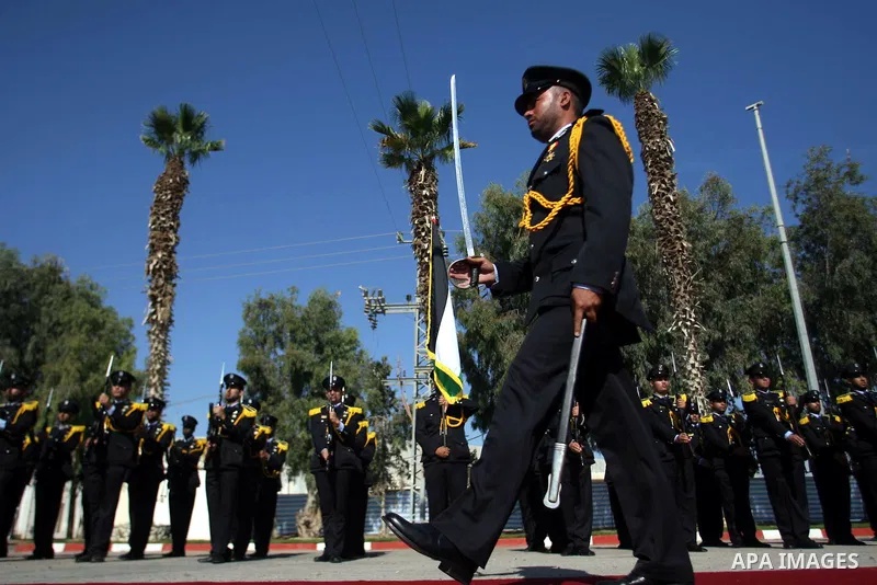 Palestinian honor guards greets Emir of Qatar Sheikh Hamad bin Khalifa al-Thani during a welcome ceremony in Rafah, southern Gaza Strip, Tuesday, Oct. 23, 2012. The Emir of Qatar entered the Gaza Strip on Tuesday for a v...