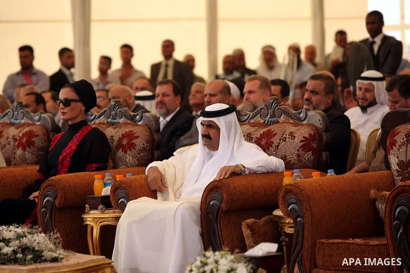 Palestinian Prime Minister in Gaza Strip, Ismail Haniyeh with the Emir of Qatar Sheik Hamad bin Khalifa al-Thani arrive to attend the opening ceremony for housing project in the southern Gaza Strip town of Khan Yunis, Oc...