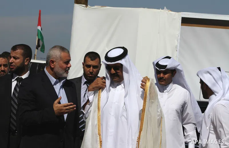 Palestinian Prime Minister in Gaza Strip, Ismail Haniyeh with the Emir of Qatar Sheik Hamad bin Khalifa al-Thani arrive to attend the opening ceremony for housing project in the southern Gaza Strip town of Khan Yunis, Oc...